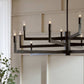 Modern black chandelier with multiple lights in a room setting.