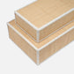 Set of two beige storage boxes with white rims on a white background