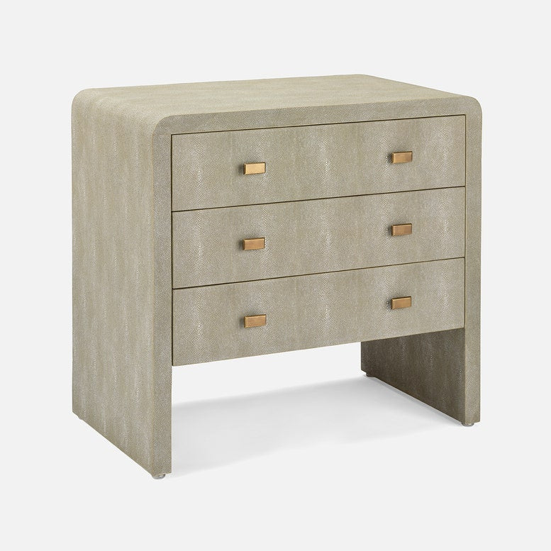 Beige textured nightstand with gold accents on a white background