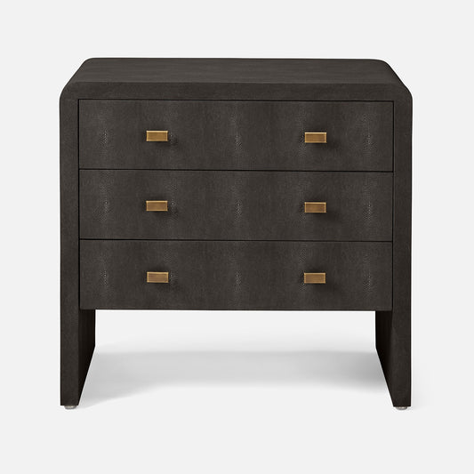 Dark wood nightstand with four drawers and brass handles on a white background