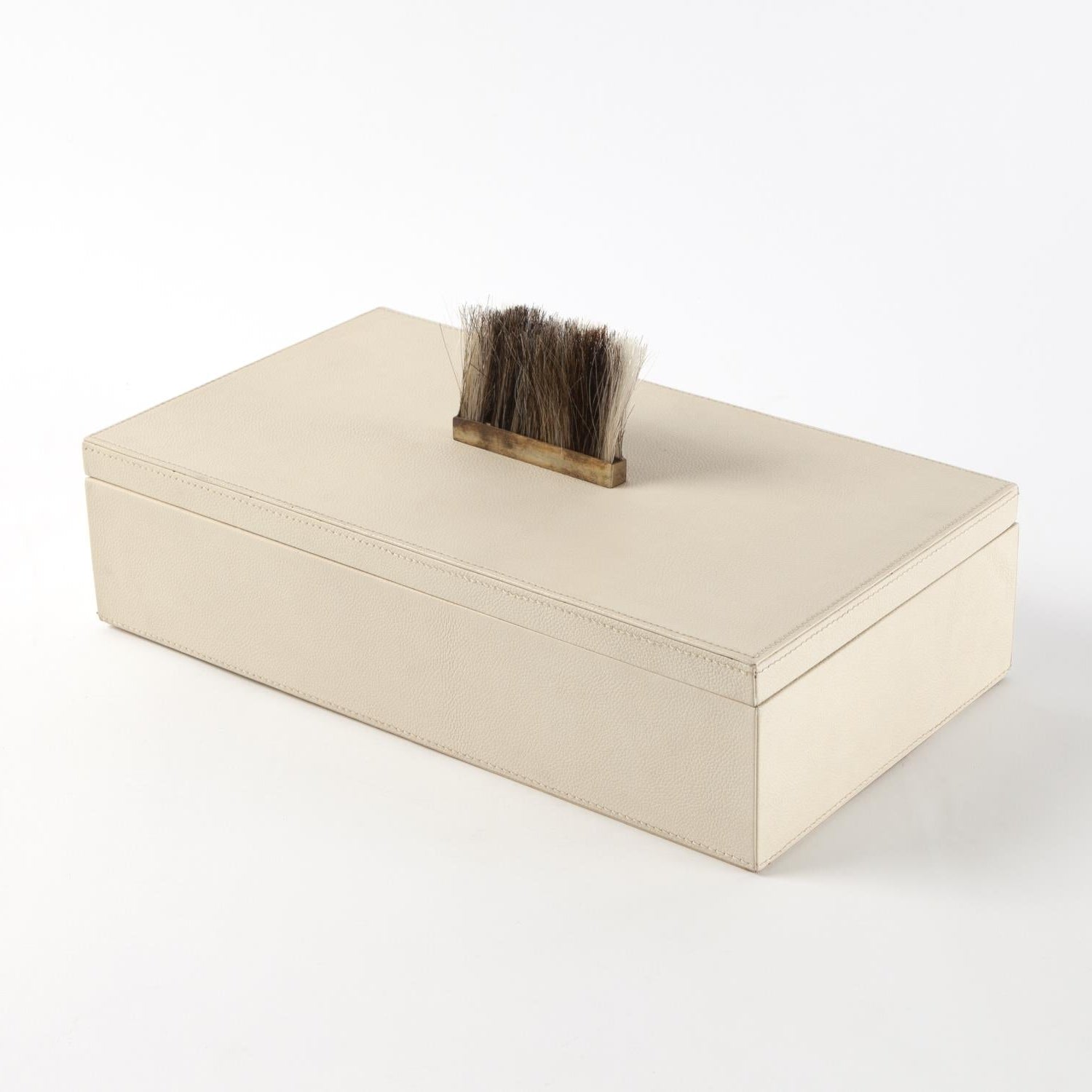 Beige jewelry box with a brush on a white background