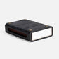 Black rectangular object with a reflective surface on a white background