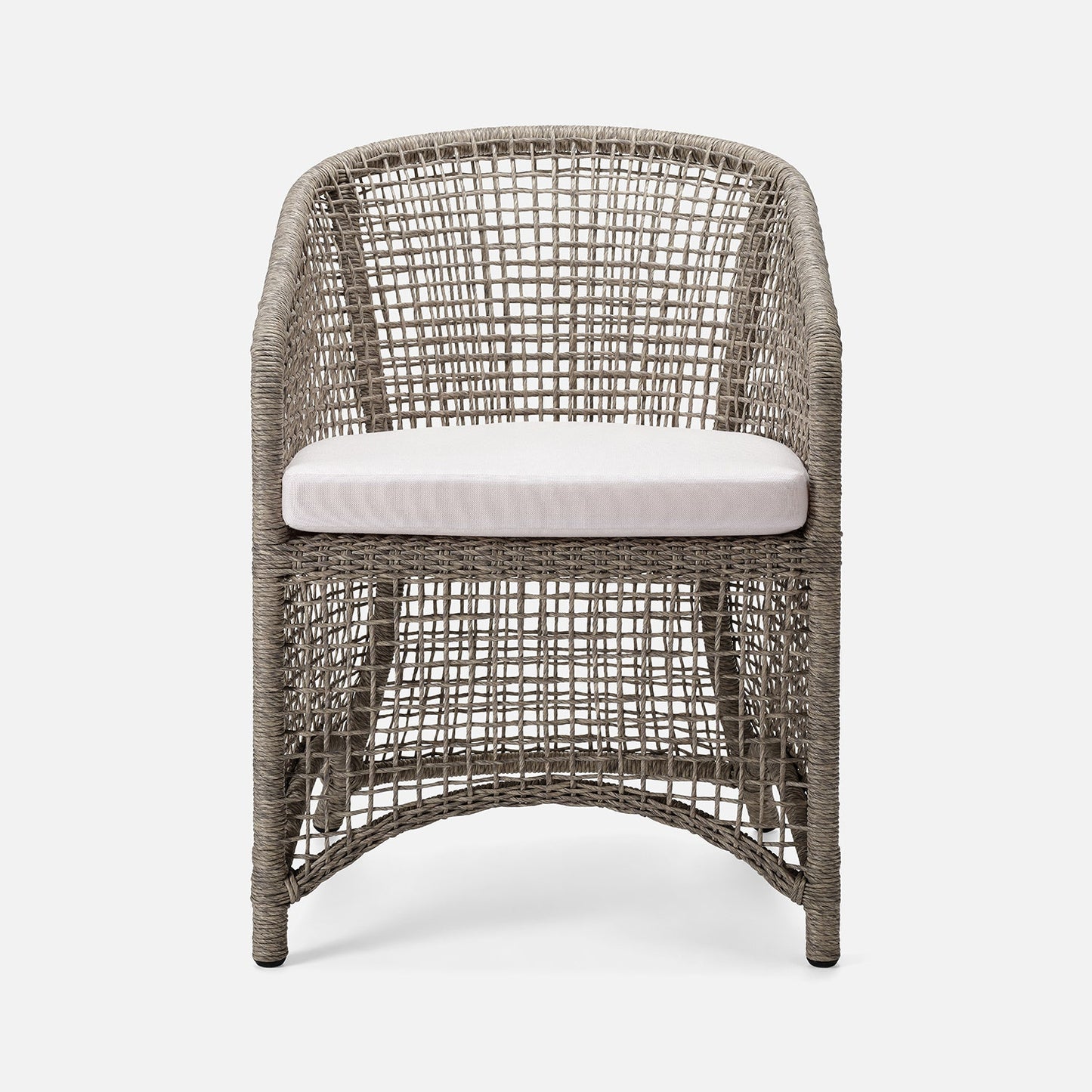 Wicker chair with a white cushion on a white background