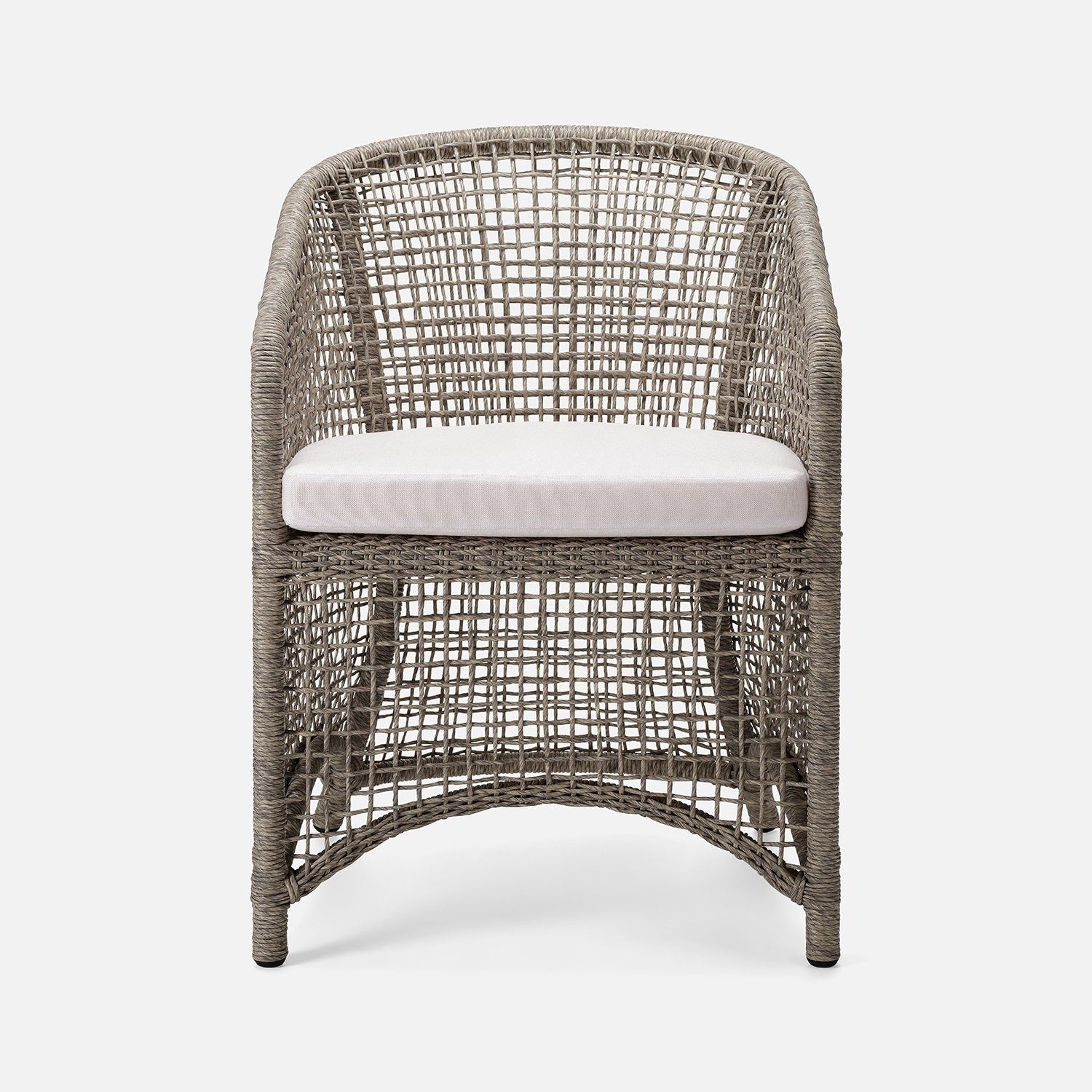 Wicker chair with a white cushion on a white background