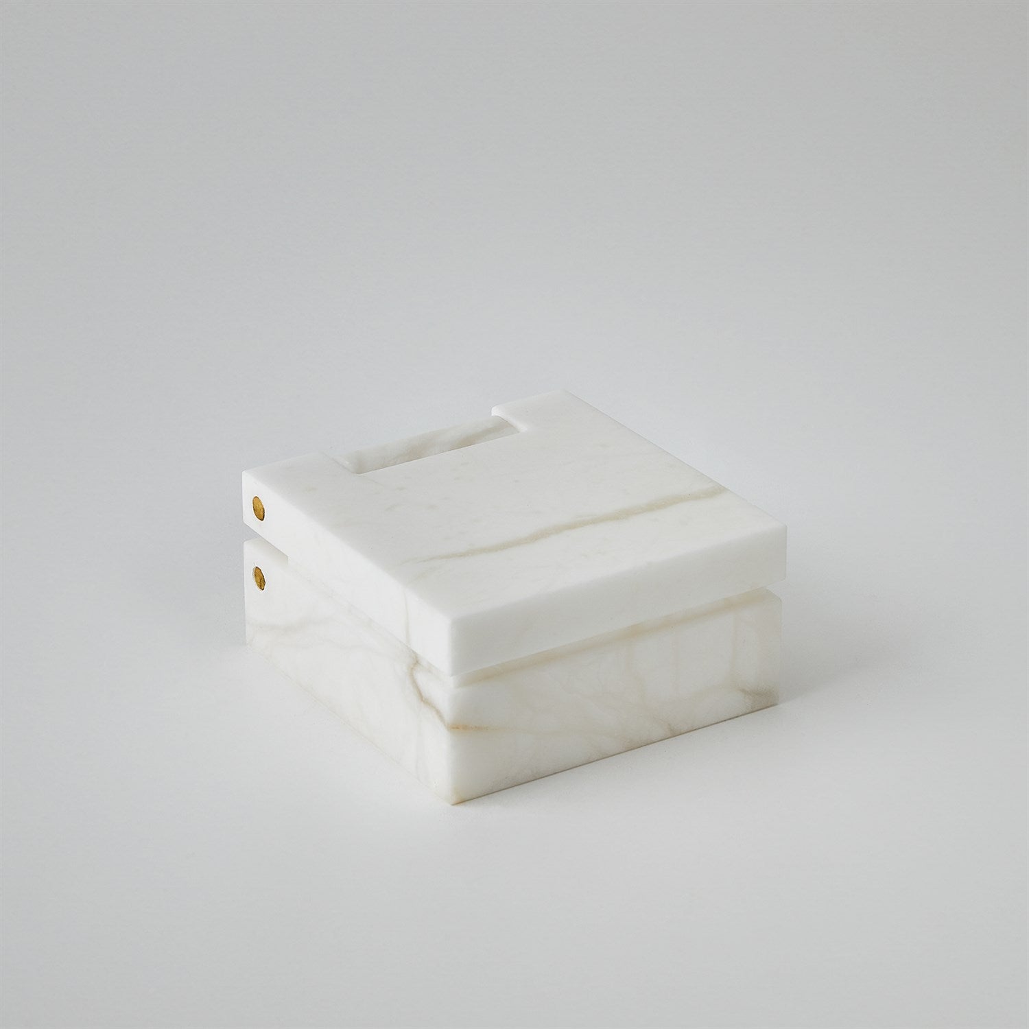 White rectangular box with gold accents on a white background