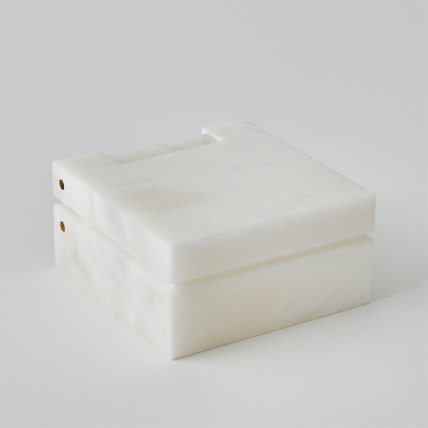 White jewelry box on a light gray background
