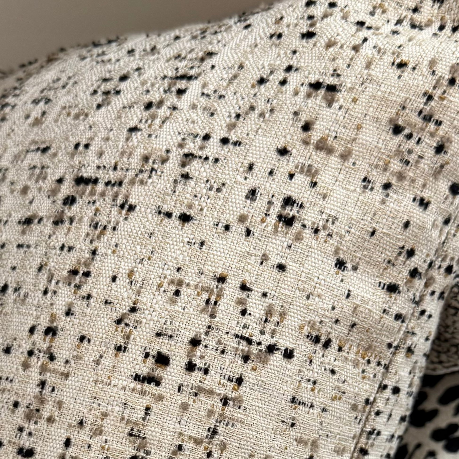 Close-up of textured fabric with black and brown speckles