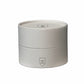 Round white candle container with a logo on a white background