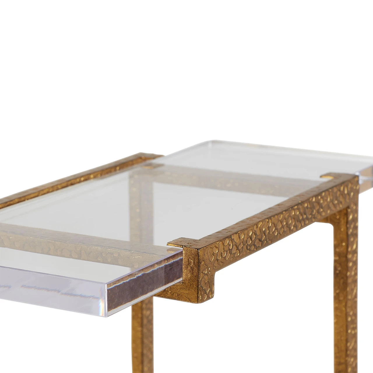 Glass-top coffee table with gold decorative frame on a white background