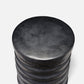 Stack of black cylindrical objects on a white background