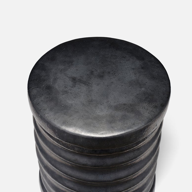 Stack of black cylindrical objects on a white background