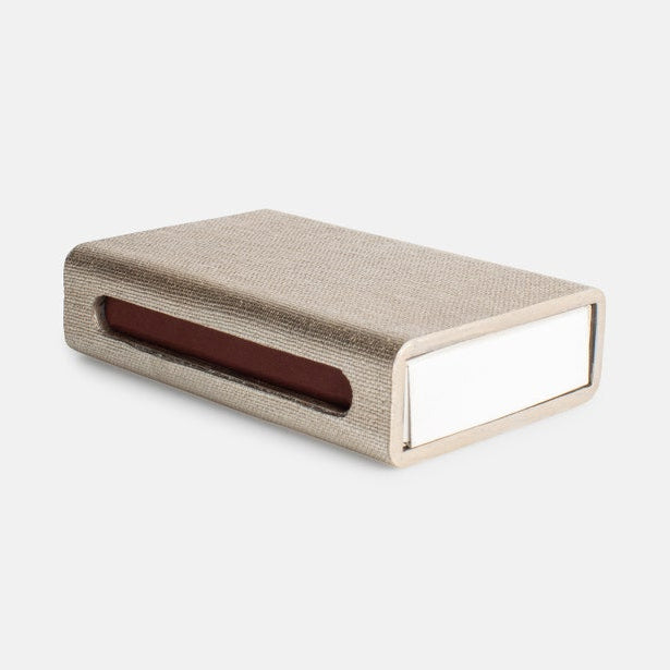 Rectangular fabric-covered box with a brown interior on a white background