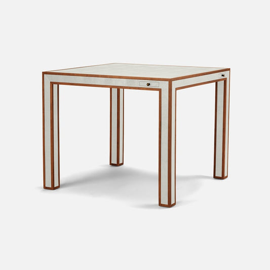 Square table with white surface and brown frame on a white background