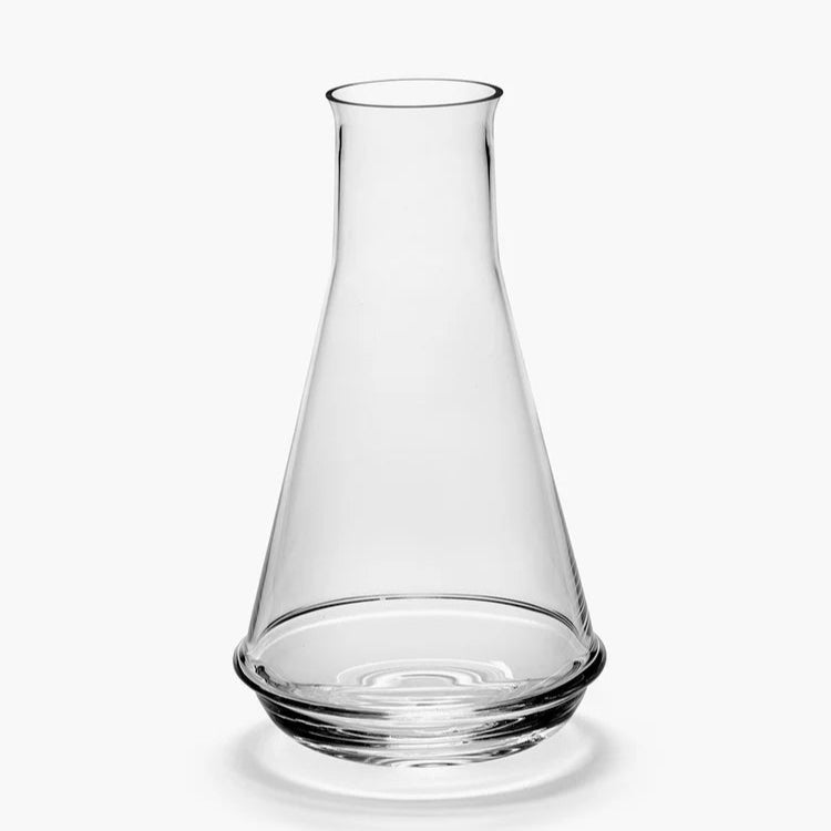 Clear glass carafe on a white background