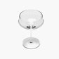 Clear glass cocktail glass on a white background