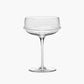 Clear glass coupe on a white background
