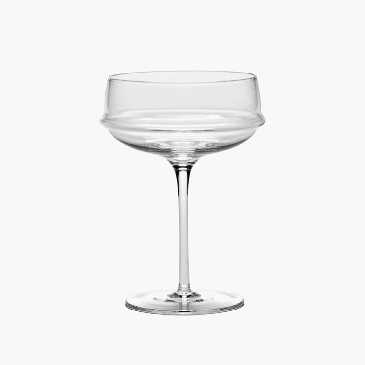 Clear glass coupe on a white background