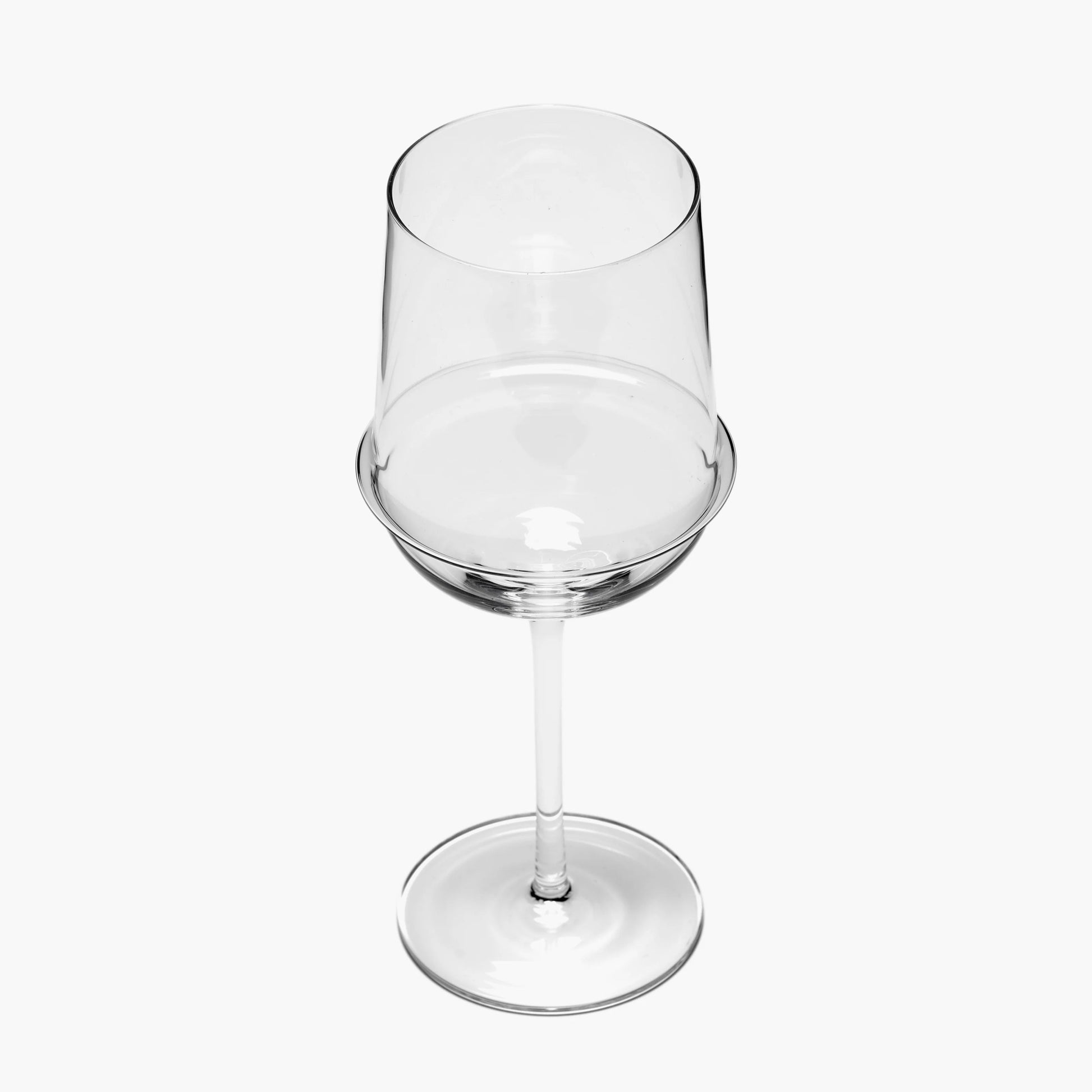 Clear wine glass on a white background