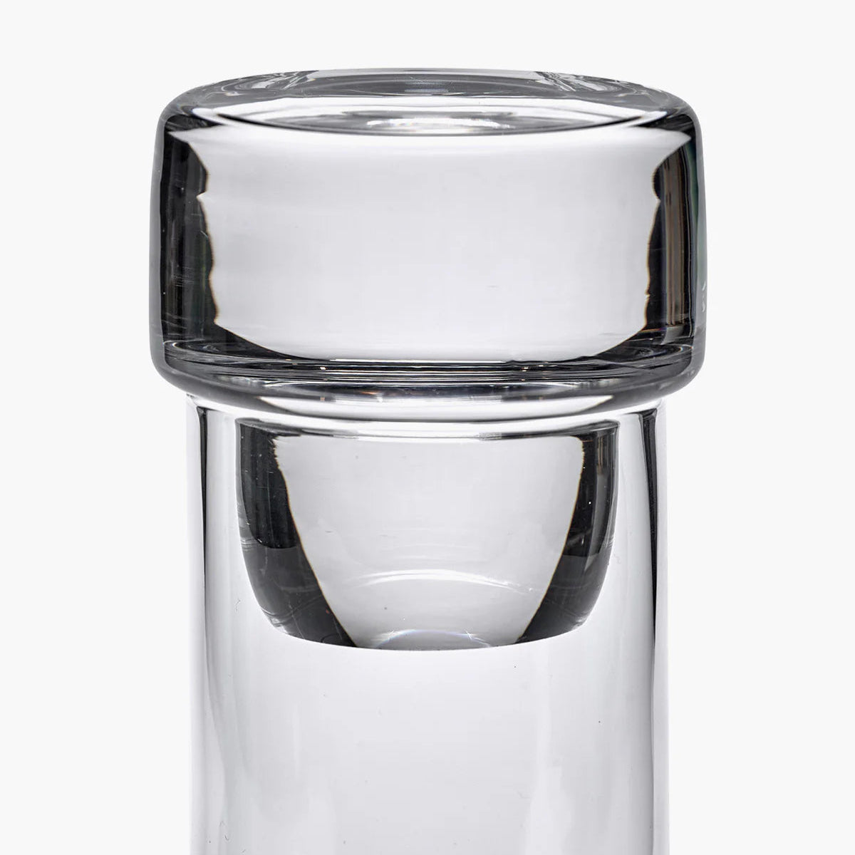 Clear glass tumbler with a white interior on a white background