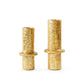 Two gold cylindrical objects on a white background