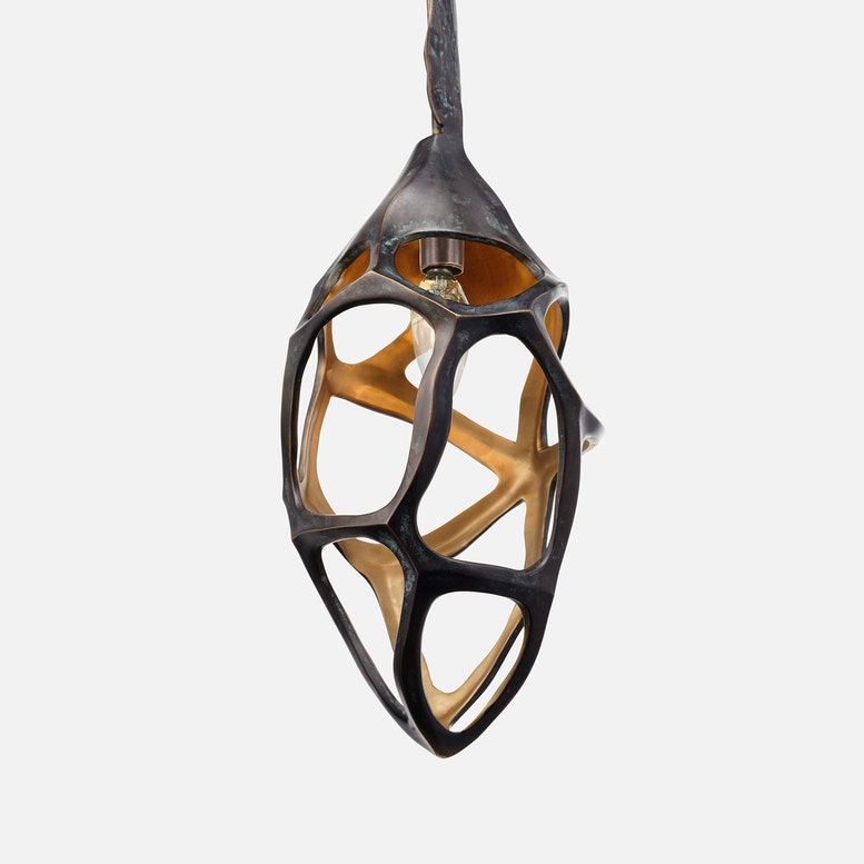 Modern pendant light with geometric design on a white background