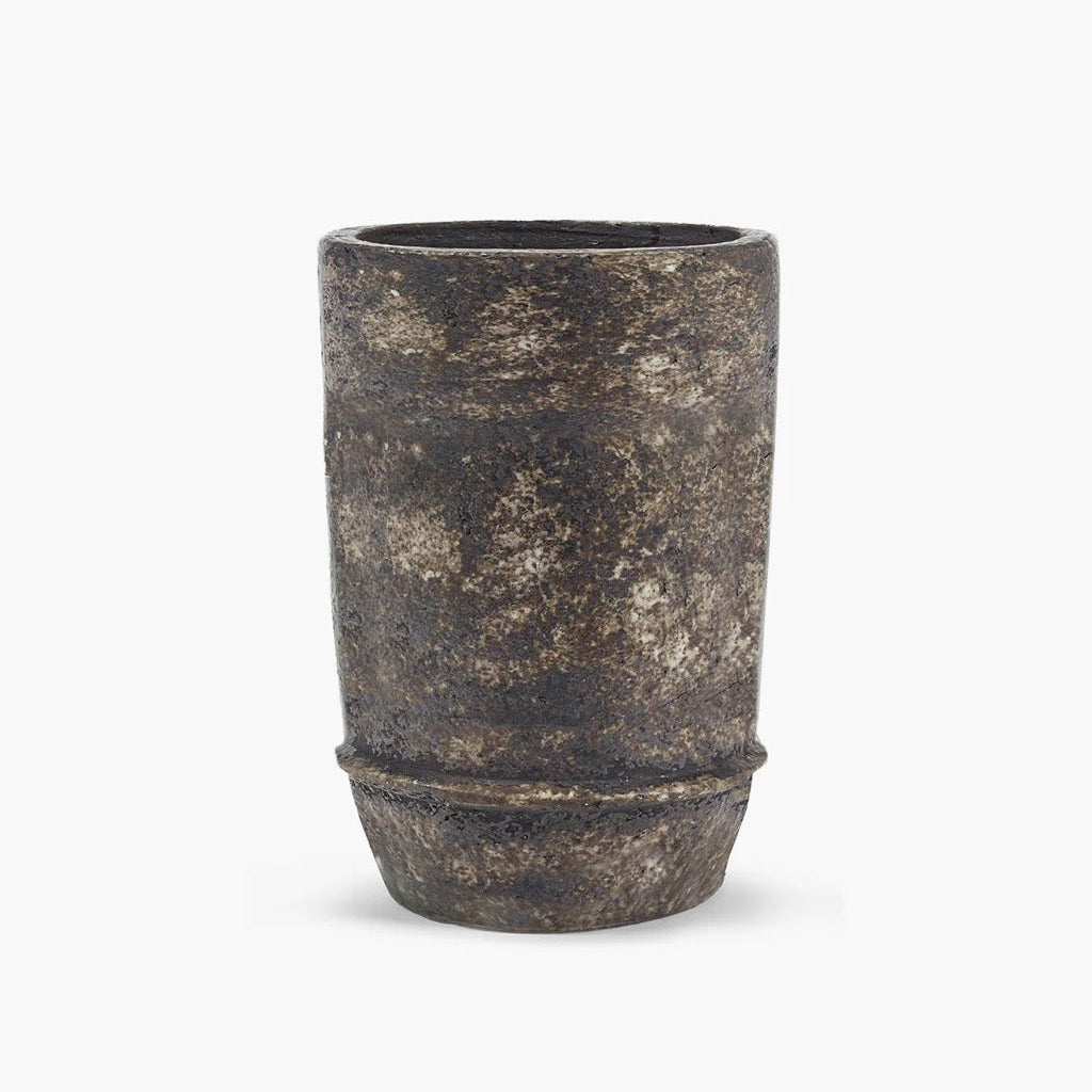 Textured black ceramic planter on a white background