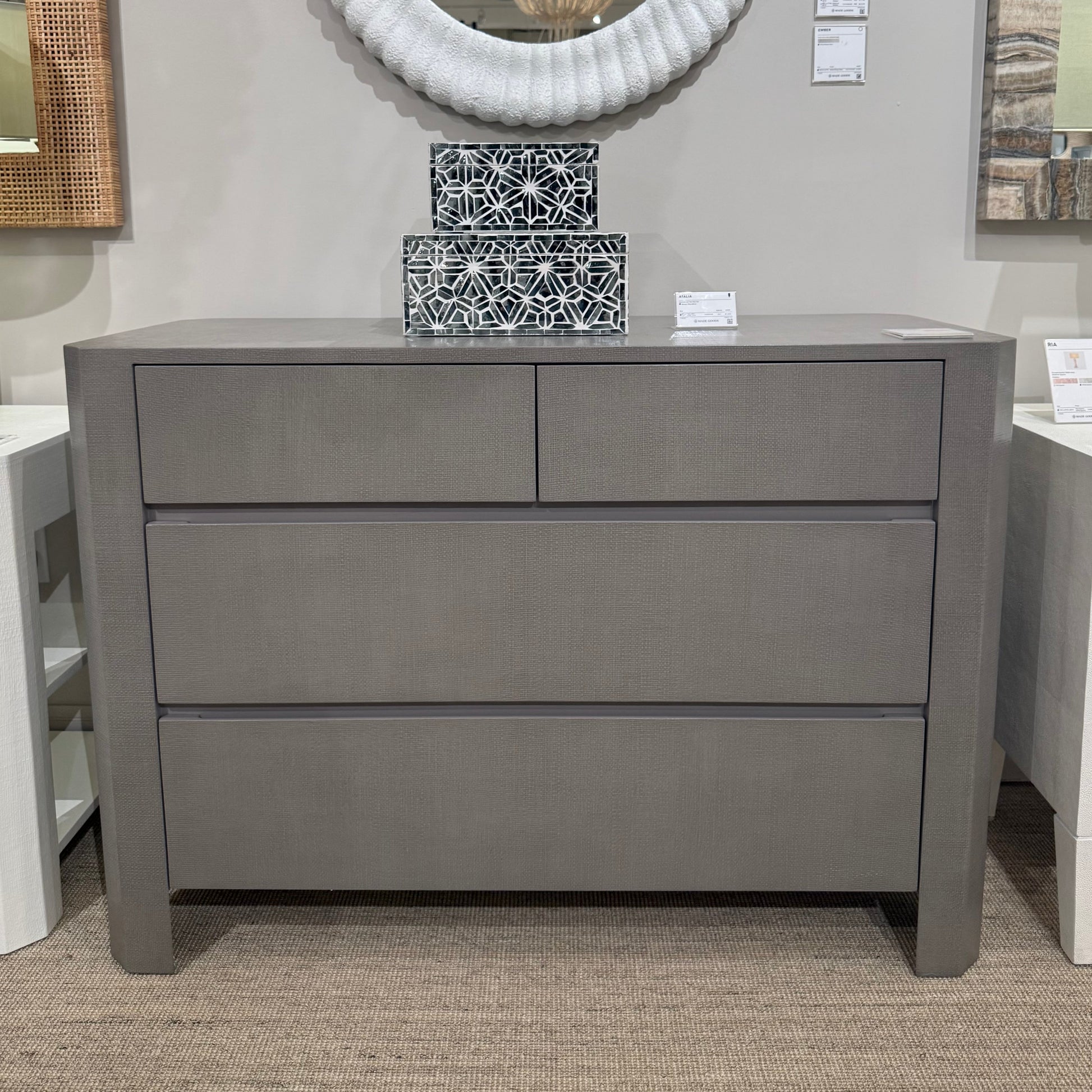 Gray dresser with decorative items in a room setting