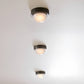 Three ceiling lights on a white ceiling