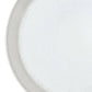 Close-up of a roll of silver wire on a white background
