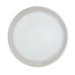 Round metallic object with a white center on a white background