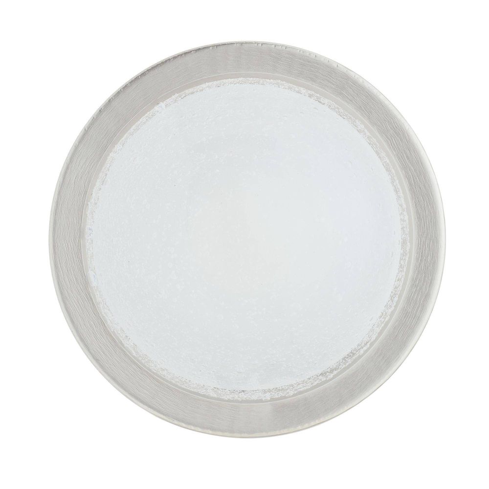 Round metallic object with a white center on a white background