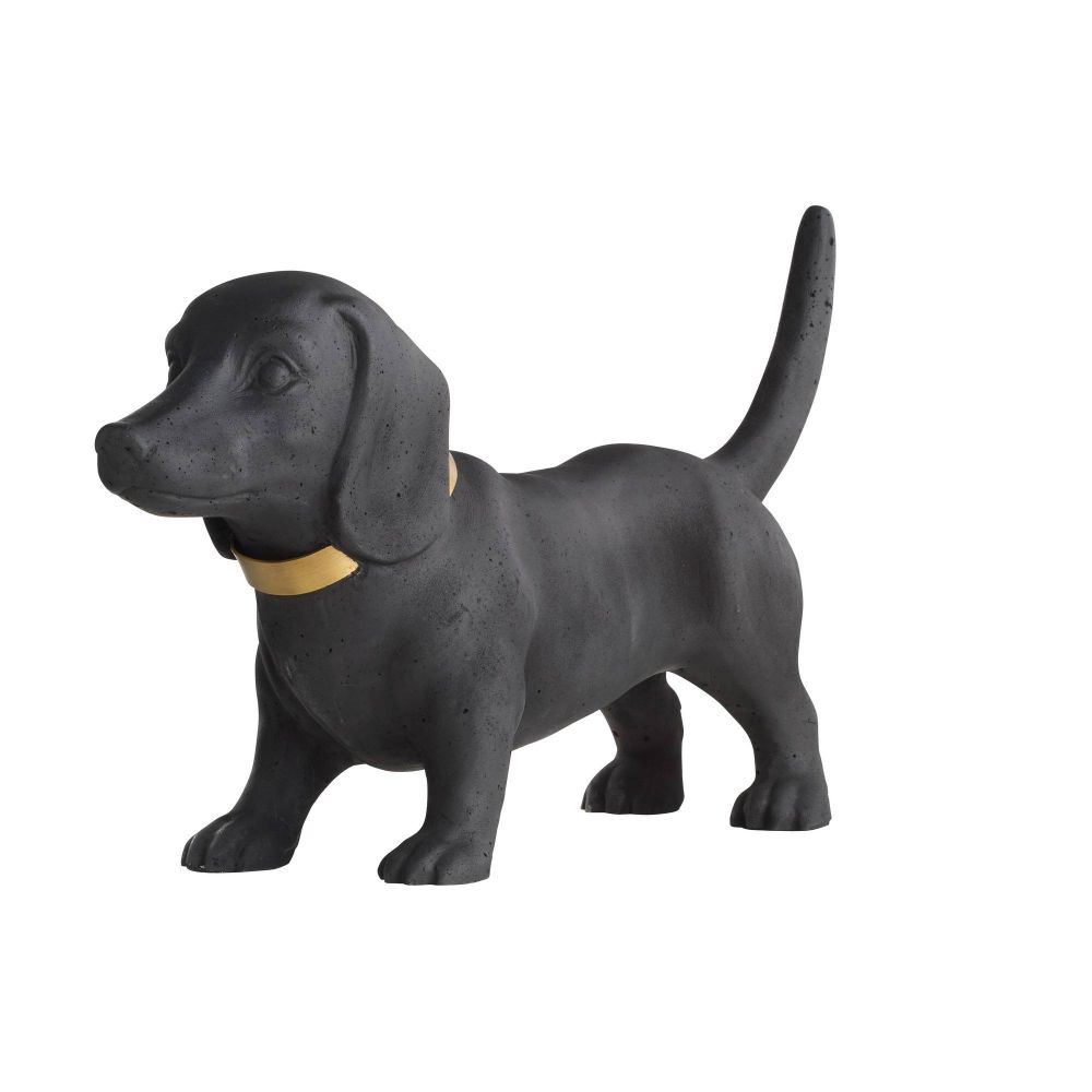 Black dog figurine with a gold collar on a white background