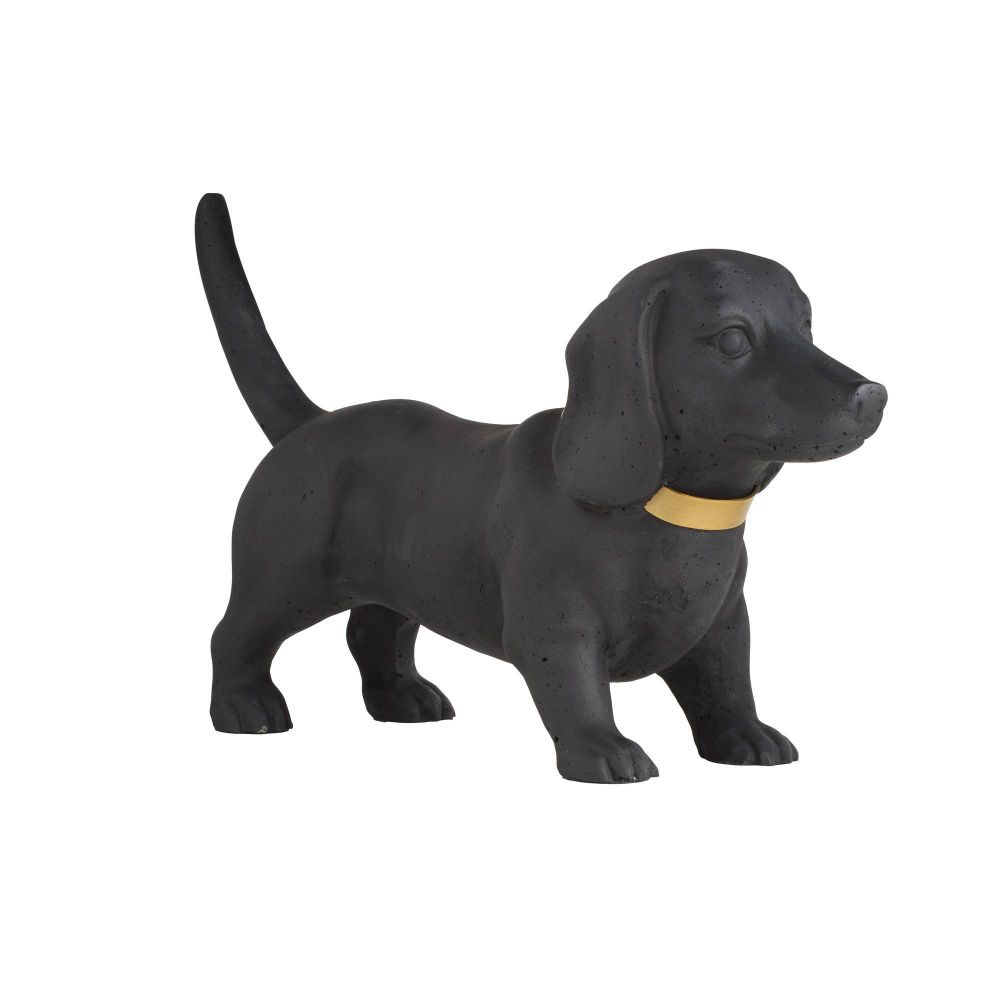Black dog figurine with a gold collar on a white background