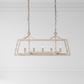 Rectangular pendant light fixture hanging against a white wall