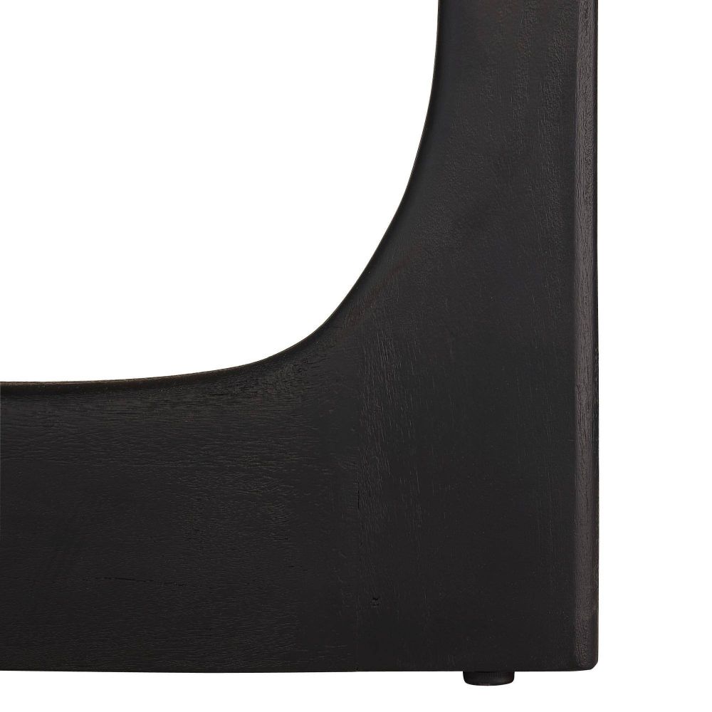 Close-up of a black leather chair seat on a white background