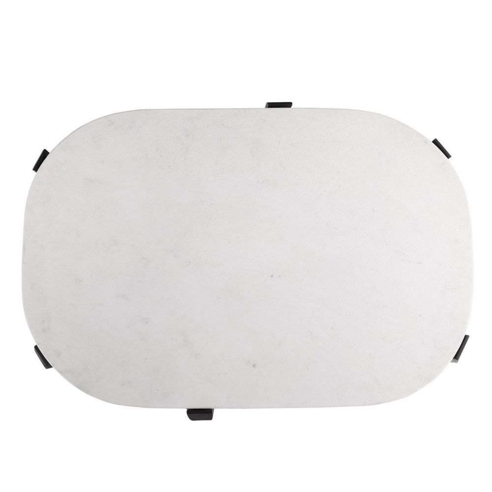 Round white object with black accents on a white background