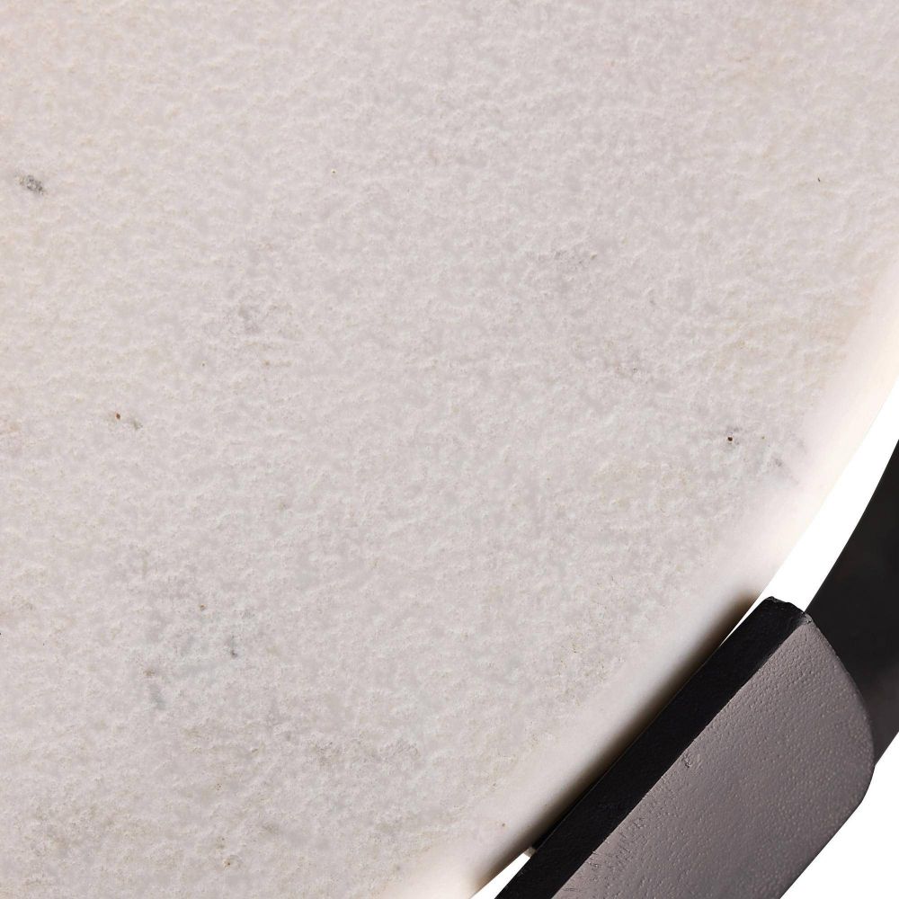 Close-up of a textured beige surface with a knife blade on the right side.