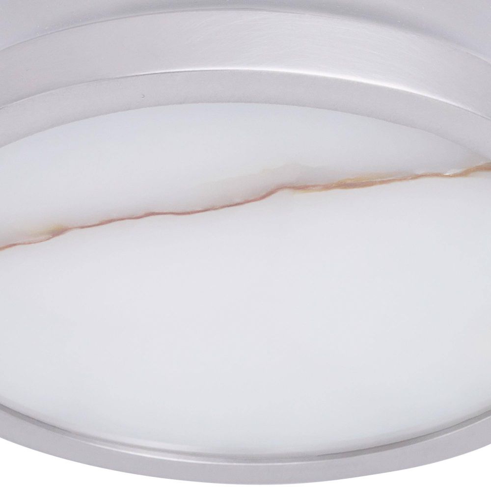 Close-up of a white ceiling light fixture with a gold accent