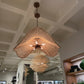 Chandelier hanging from a ceiling in a store setting