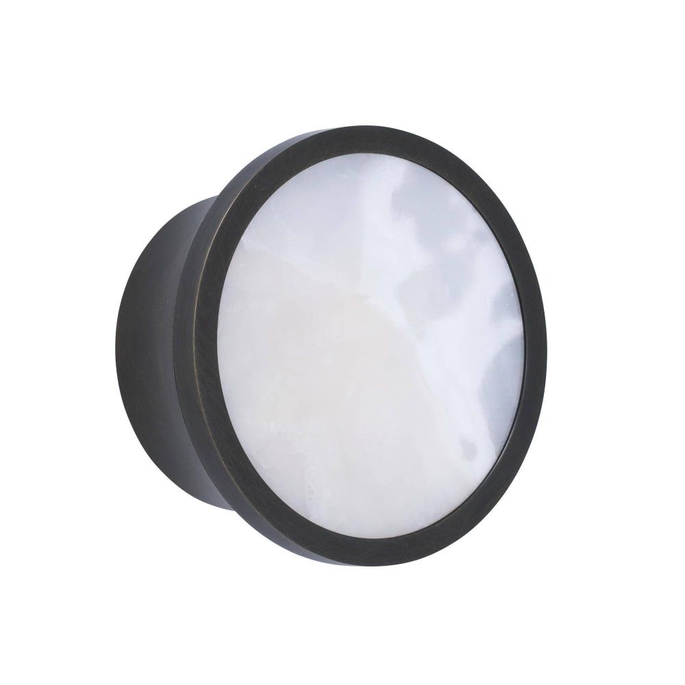 Round light fixture with black frame on a white background