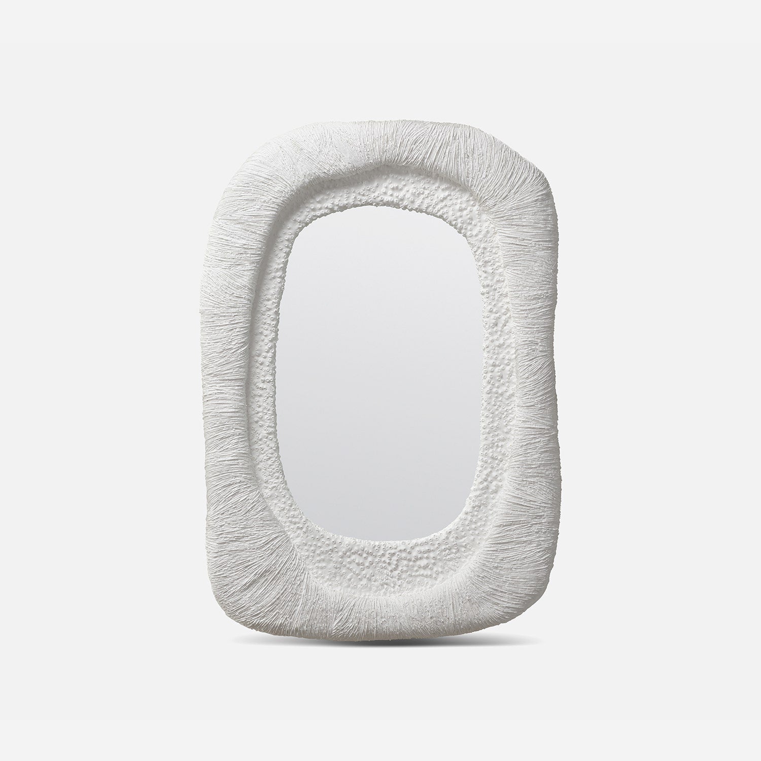 Decorative mirror with textured frame on a white background