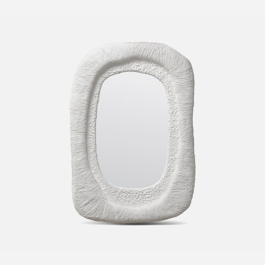 Decorative mirror with textured frame on a white background