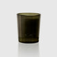 Dark green glass candle holder on a white background