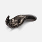 Bronze sculpture of a hand holding a foot on a white background