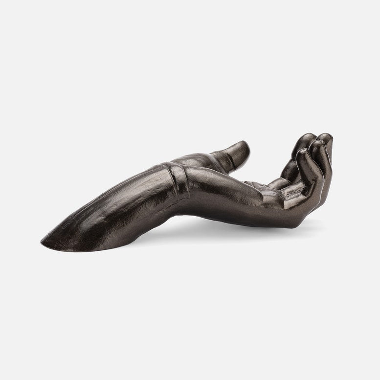 Bronze hand sculpture on a white background