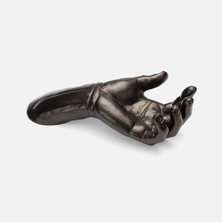 Bronze hand sculpture on a white background