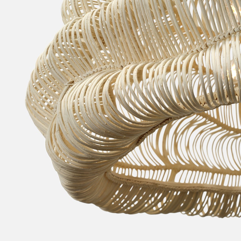 Close-up of a woven beige basket on a white background