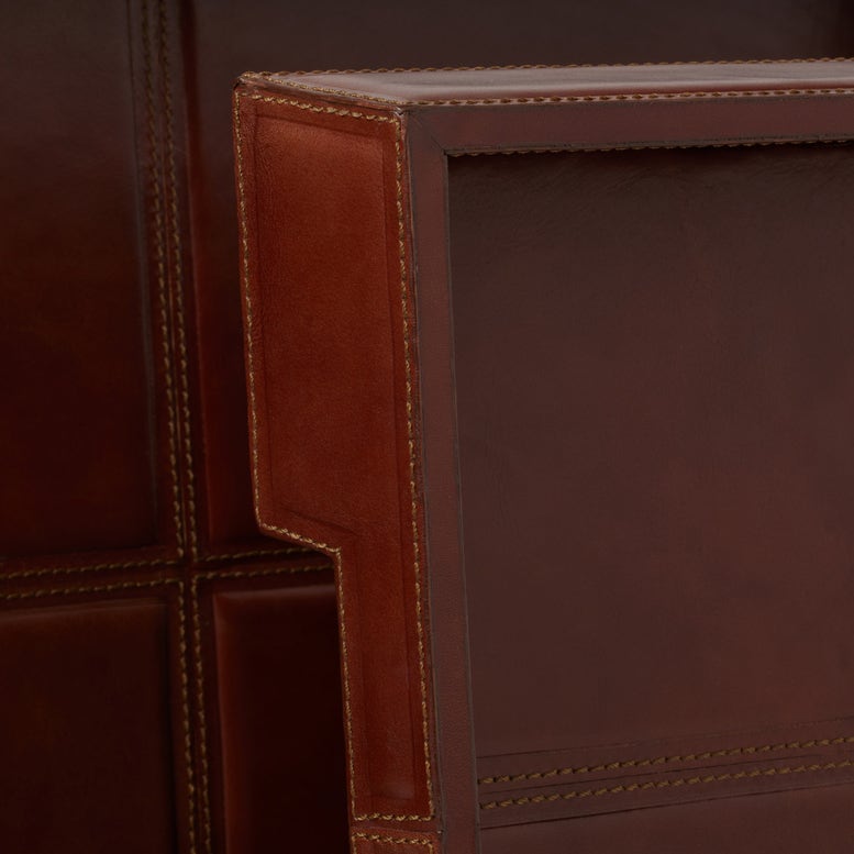 Close-up of a brown leather product with stitching details