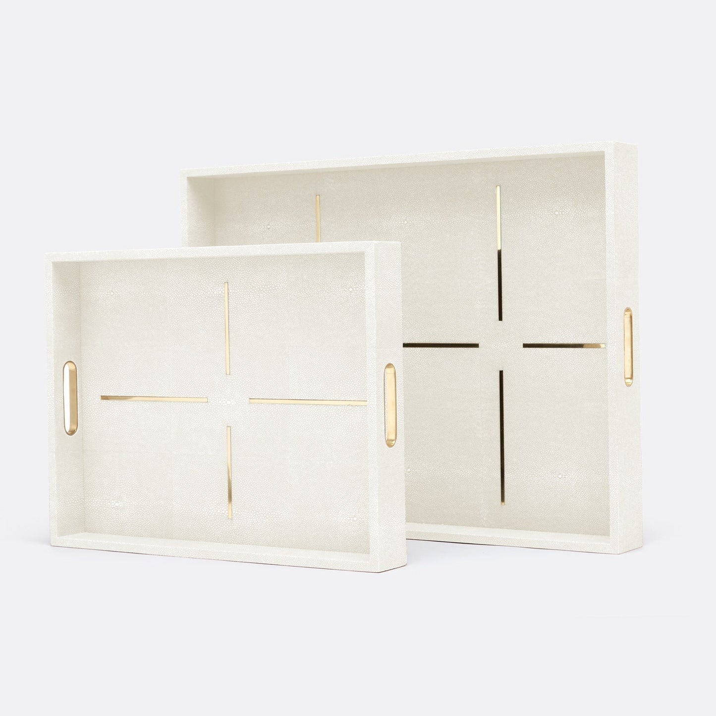 Two cream-colored trays with gold accents on a white background