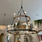 gray and black two tiered chandelier in a showroom